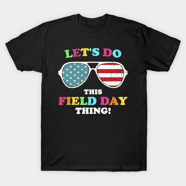 Black T-shirt with colorful text and American flag sunglasses design, perfect for field day events.