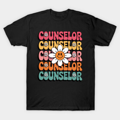 Black t-shirt with colorful retro "Counselor" text and smiley daisy graphic, casual style, cotton material.