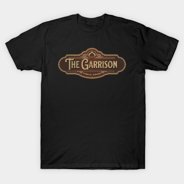 Black T-shirt with vintage "The Garrison" pub logo in brown and gold, casual wear, cotton material.