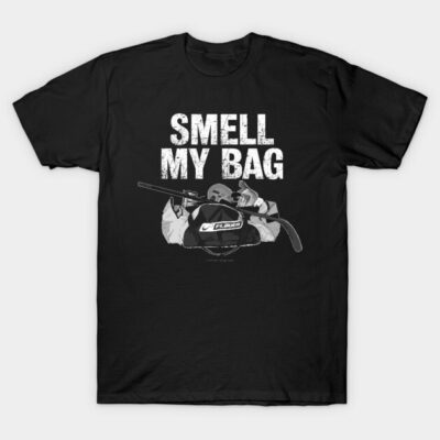 Black novelty t-shirt with "Smell My Bag" text and hockey gear graphic, perfect for casual wear or sports enthusiasts.