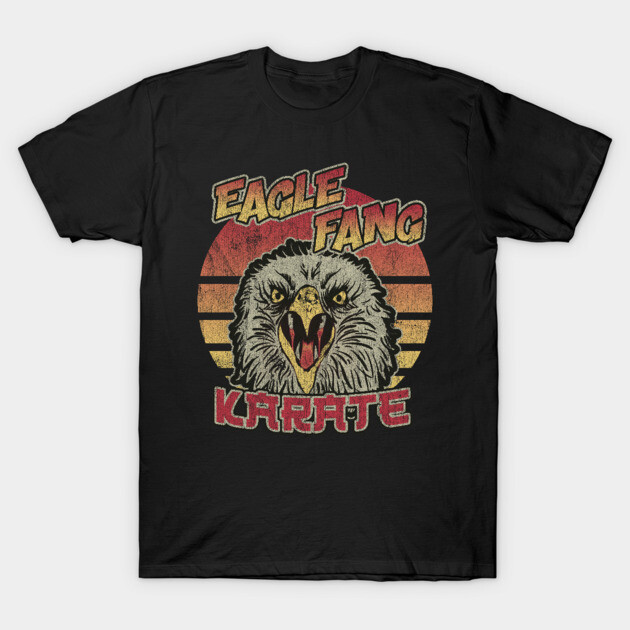 Black t-shirt with vintage eagle design and bold text, perfect for casual wear. Retro style and comfortable cotton material.