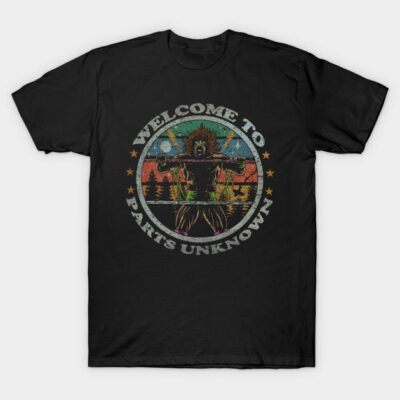 Black graphic t-shirt with retro design, "Welcome to Parts Unknown" text, featuring a colorful wrestling theme.