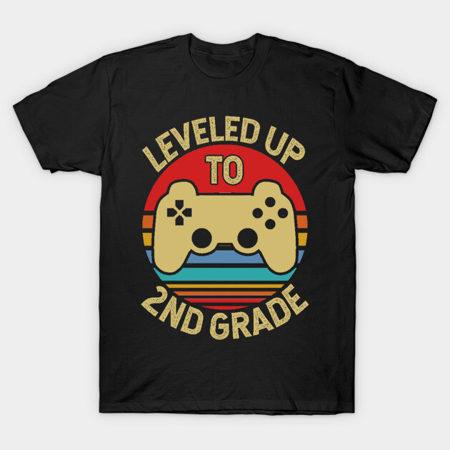 Black t-shirt with "Leveled Up to 2nd Grade" graphic, featuring a yellow game controller and retro stripes.