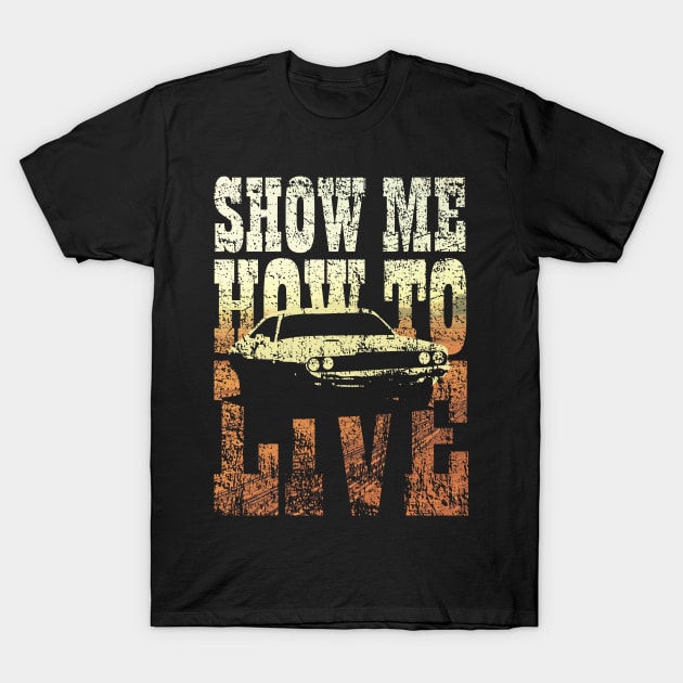 Black graphic t-shirt with vintage car design and "Show Me How to Live" text, casual wear for car enthusiasts.