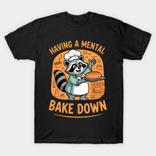 Black t-shirt with playful raccoon chef graphic, "Having a Mental Bake Down" text, perfect for casual wear.