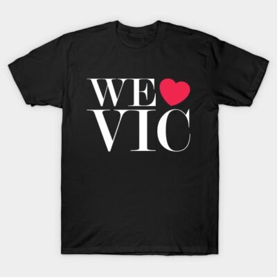 Black t-shirt with "We Love Vic" design, featuring white text and red heart, perfect for casual wear and gifting.