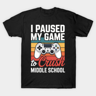 Black graphic t-shirt with "I Paused My Game to Crush Middle School" design, featuring a retro gaming controller.