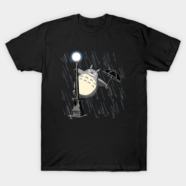 Black graphic t-shirt featuring a whimsical rain scene with a street lamp and umbrella illustration, casual cotton wear.