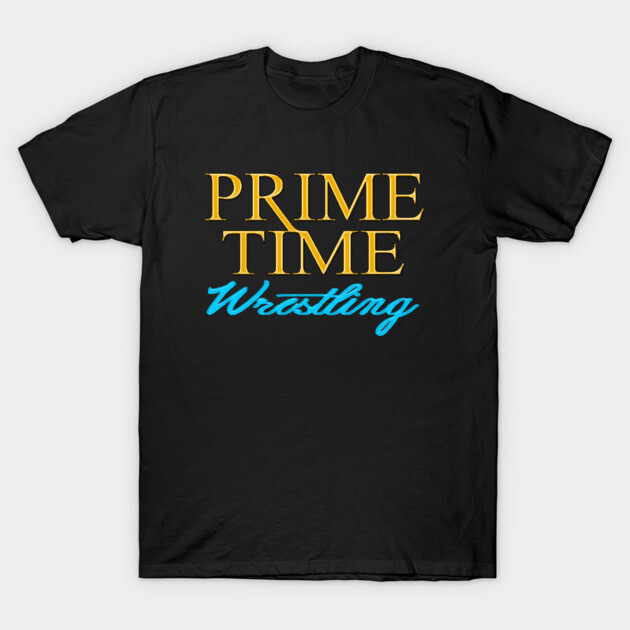 Black t-shirt with "Prime Time Wrestling" graphic in yellow and blue text, casual style, cotton fabric.