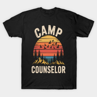Black "Camp Counselor" T-shirt with retro sunset design, featuring birds and trees, ideal for outdoor enthusiasts.