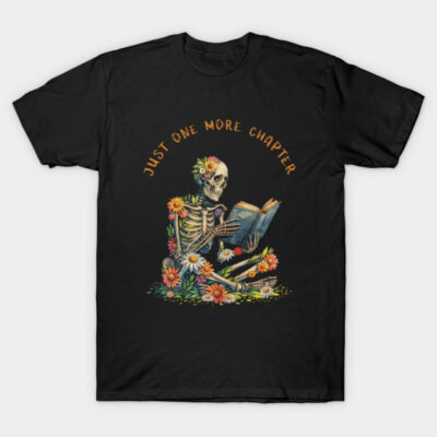 Black t-shirt with colorful skeleton reading design, "Just One More Chapter" text, floral accents, casual wear.