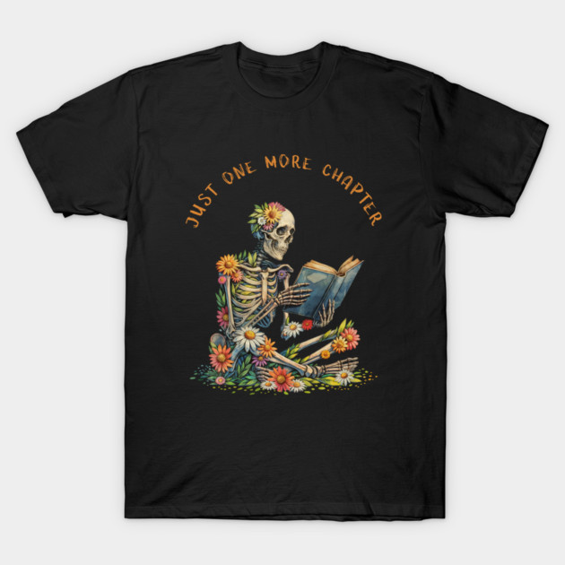 Black t-shirt with colorful skeleton reading design, "Just One More Chapter" text, floral accents, casual wear.