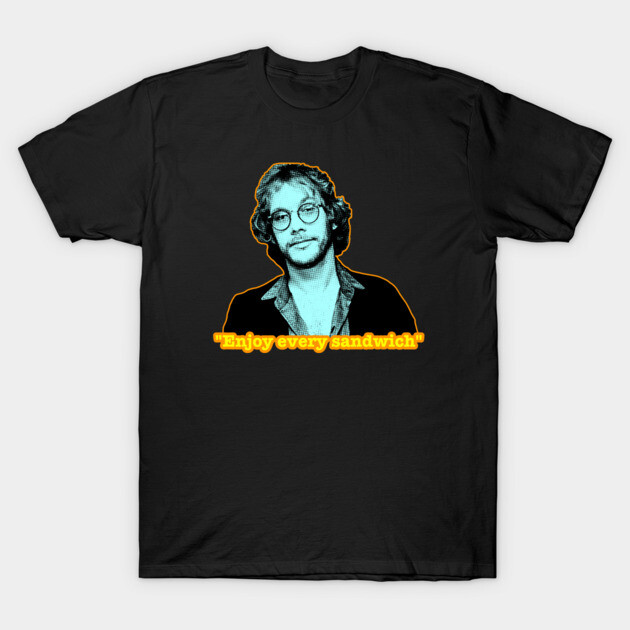 Black graphic T-shirt with retro design and "Enjoy every sandwich" text, casual style, cotton material.