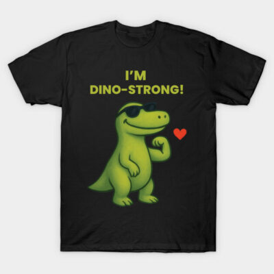 Black T-shirt with green cartoon dinosaur design and "I'm Dino-Strong" text, playful casual wear for kids and adults.