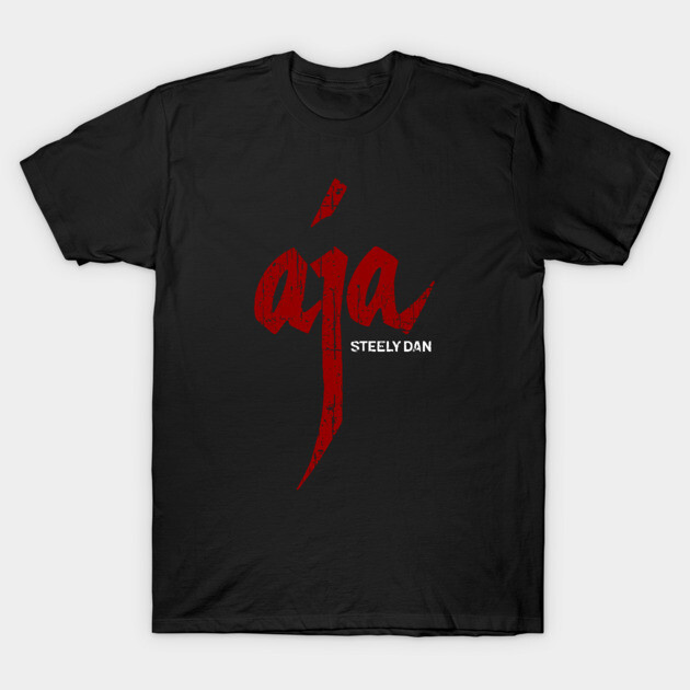 Black T-shirt with red "Aja" graphic design, casual wear, 100% cotton, unisex style, music-themed.