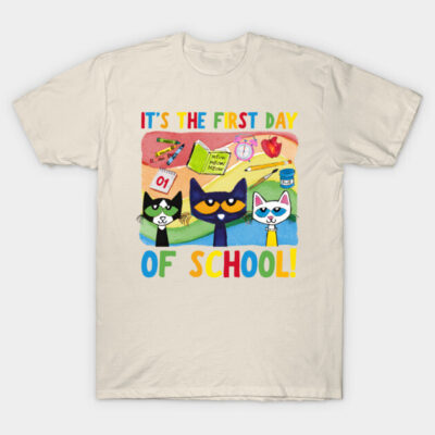 Beige t-shirt with colorful "First Day of School" cat design, perfect for kids, soft cotton fabric, casual style.