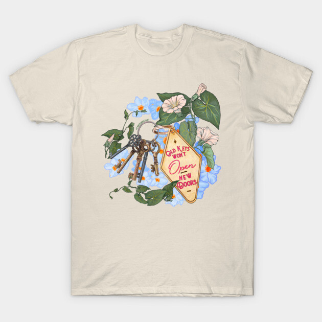 Beige cotton T-shirt with floral and key design, featuring the phrase "Old Keys Won't Open New Doors." Casual wear.