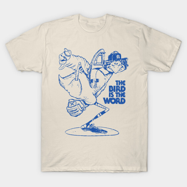 Cream t-shirt with blue cartoon bird print, "The Bird Is The Word" text, casual cotton tee, unisex style.