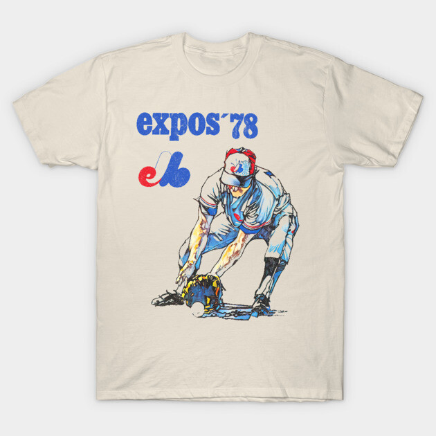 Vintage-style beige t-shirt featuring "Expos '78" graphic with baseball player illustration, perfect for casual wear.