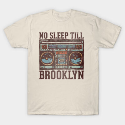 Beige T-shirt with vintage boombox graphic and "No Sleep Till Brooklyn" text, casual wear, cotton fabric.