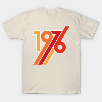 Beige t-shirt with retro "1976" graphic print in red and orange, cotton material, casual vintage style.