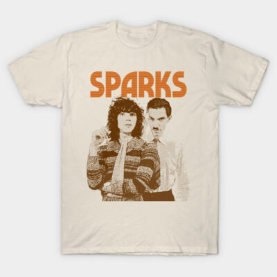 Cream t-shirt with vintage graphic design and "SPARKS" text in orange. Casual style, perfect for music enthusiasts.