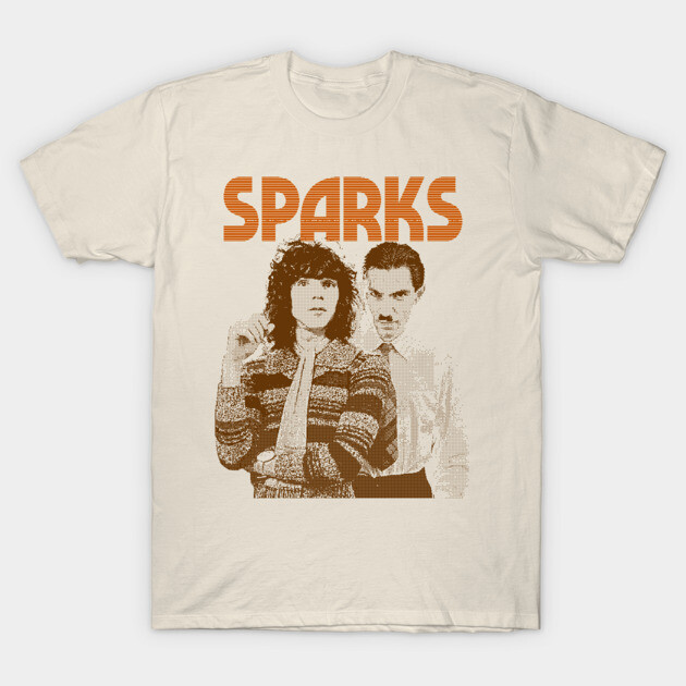 Cream t-shirt with vintage graphic design and "SPARKS" text in orange. Casual style, perfect for music enthusiasts.