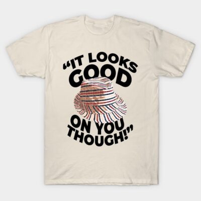Beige t-shirt with striped hat graphic and text "It Looks Good on You Though," casual wear, cotton blend, unisex style.
