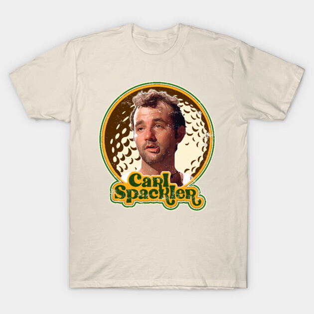 Beige graphic t-shirt featuring retro design with bold text, suitable for casual wear. Ideal for fans of vintage style.