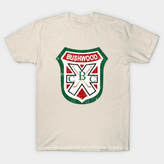 Ivory t-shirt with vintage-style Bushwood logo, featuring red, green, and white colors, ideal for casual wear.