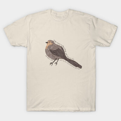 Cream T-shirt with bird illustration and text, casual style, soft cotton, unisex design for everyday wear.
