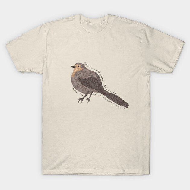 Cream T-shirt with bird illustration and text, casual style, soft cotton, unisex design for everyday wear.