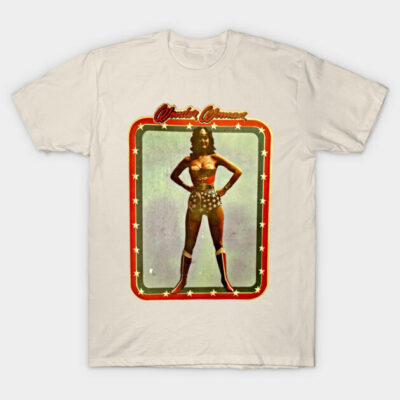 Cream t-shirt with vintage superhero graphic, red and blue accents, cotton material, casual wear.