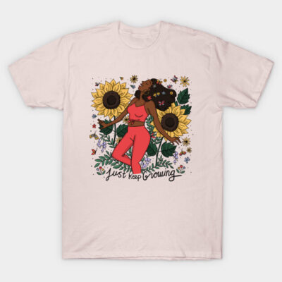 Pink T-shirt with floral and sunflower print, featuring "Just Keep Growing" text, ideal for casual wear and comfort.