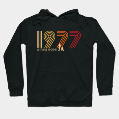 Black 1977-themed hoodie with retro-style text design, ideal for casual wear. Cozy and stylish cotton blend material.