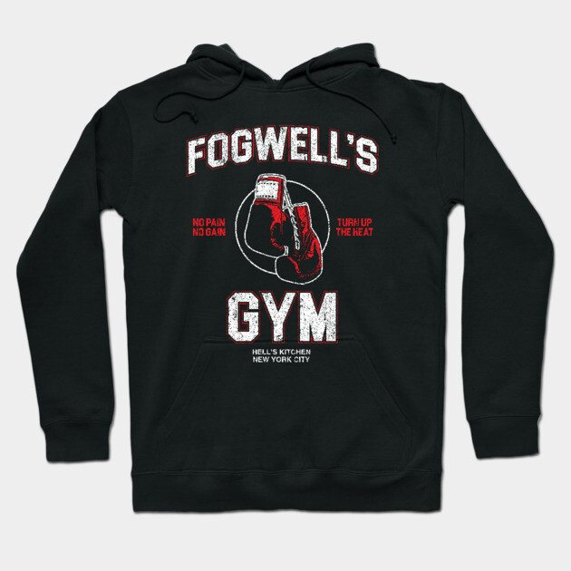 Black hoodie with "Fogwell's Gym" logo, featuring red boxing gloves graphic, perfect for casual wear and workouts.