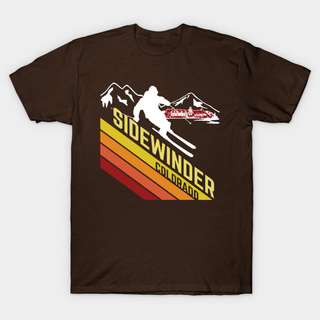 Brown t-shirt with retro ski graphic, "Sidewinder Colorado" text, featuring vibrant stripes and mountain silhouette.