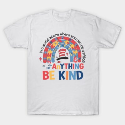 White t-shirt with colorful rainbow puzzle design and "Be Kind" text, promoting kindness and positivity.