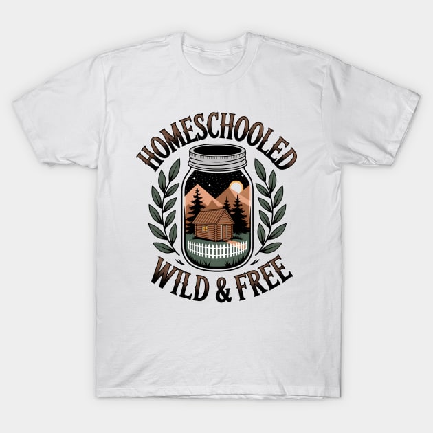 White t-shirt with "Homeschooled Wild & Free" design, featuring cabin and nature graphic. Casual, comfortable cotton wear.