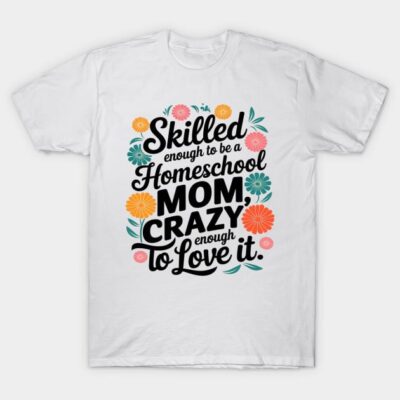 White t-shirt with colorful floral design and "Skilled Homeschool Mom" text, casual wear, cotton material.