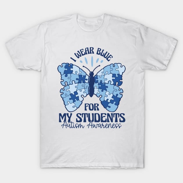White t-shirt with blue puzzle butterfly design, promoting Autism Awareness. Ideal for casual wear and supporting causes.