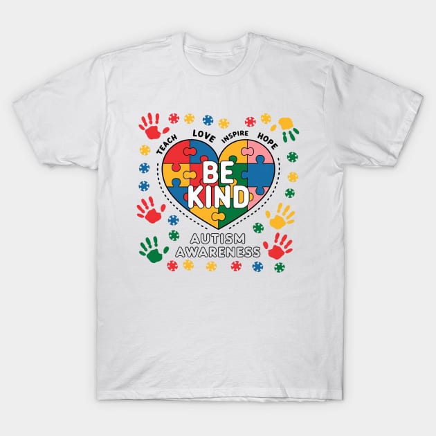 White autism awareness T-shirt with colorful puzzle heart and "Be Kind" message, made from soft cotton.
