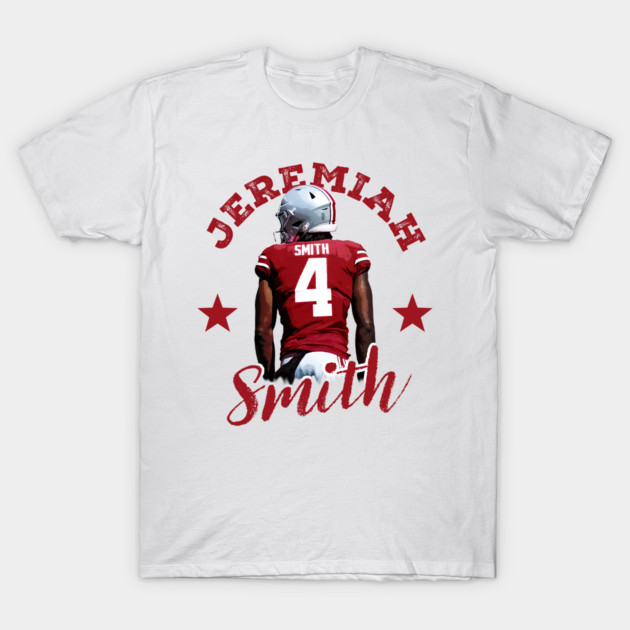White t-shirt featuring a football player graphic with red jersey and helmet, ideal for sports fans and casual wear.