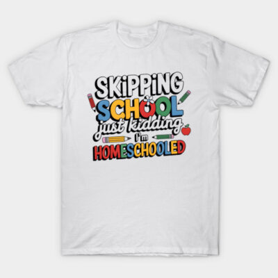 White cotton t-shirt with colorful "Skipping School, Just Kidding, I'm Homeschooled" text, casual and playful style.