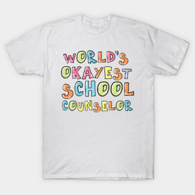 White T-shirt with colorful "World's Okayest School Counselor" text, casual style, perfect for school settings.