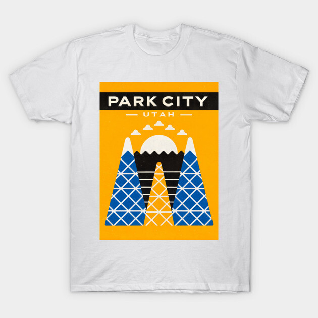White t-shirt featuring a Park City Utah graphic with blue mountains and a yellow background. Casual outdoor style.