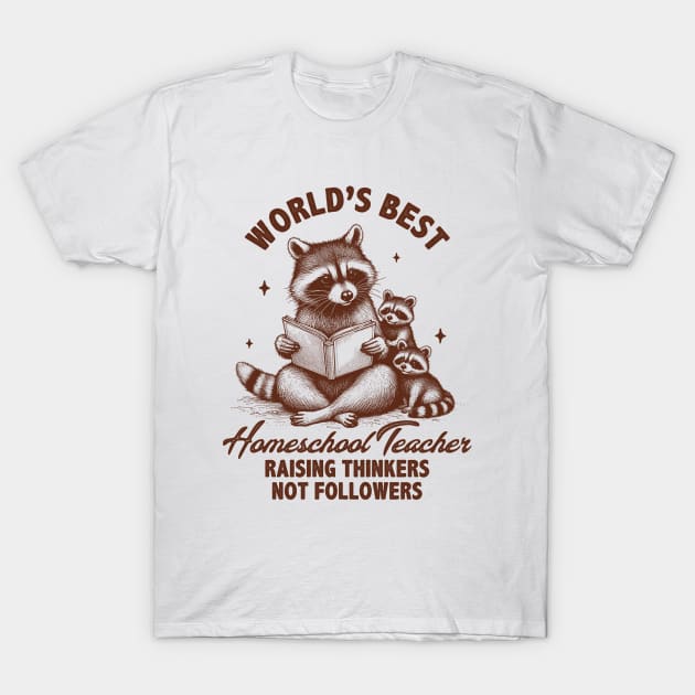 White t-shirt with raccoon print, "World's Best Homeschool Teacher" text, casual style, cotton material, gift idea.