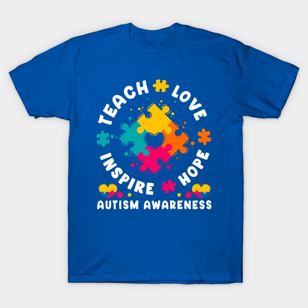 Blue autism awareness t-shirt with colorful puzzle design, "Teach Love Inspire Hope" text, cotton material, unisex fit.
