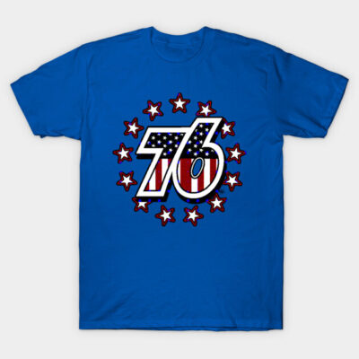Blue t-shirt with "76" graphic in American flag colors, surrounded by stars; casual wear, cotton material.