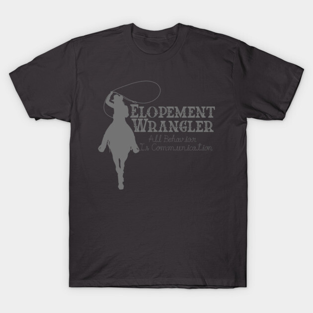 Dark gray t-shirt with "Elopement Wrangler" text and horse graphic, casual style, cotton material, unisex design.